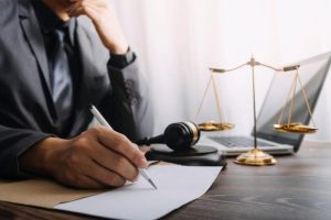 Photo of a Lawyer Working on His Desk